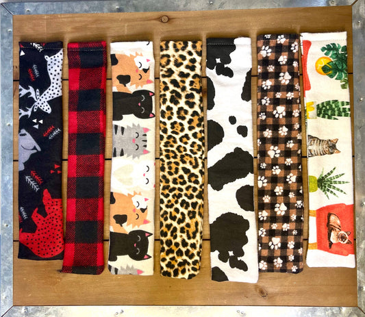 Assorted handmade valerian cat cuddlers in unique fabric patterns