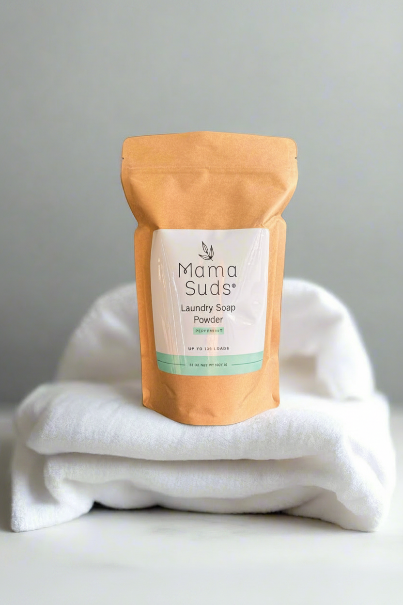 Mama Suds Peppermint Laundry Soap Powder on freshly washed towels for clean, pet-safe laundry