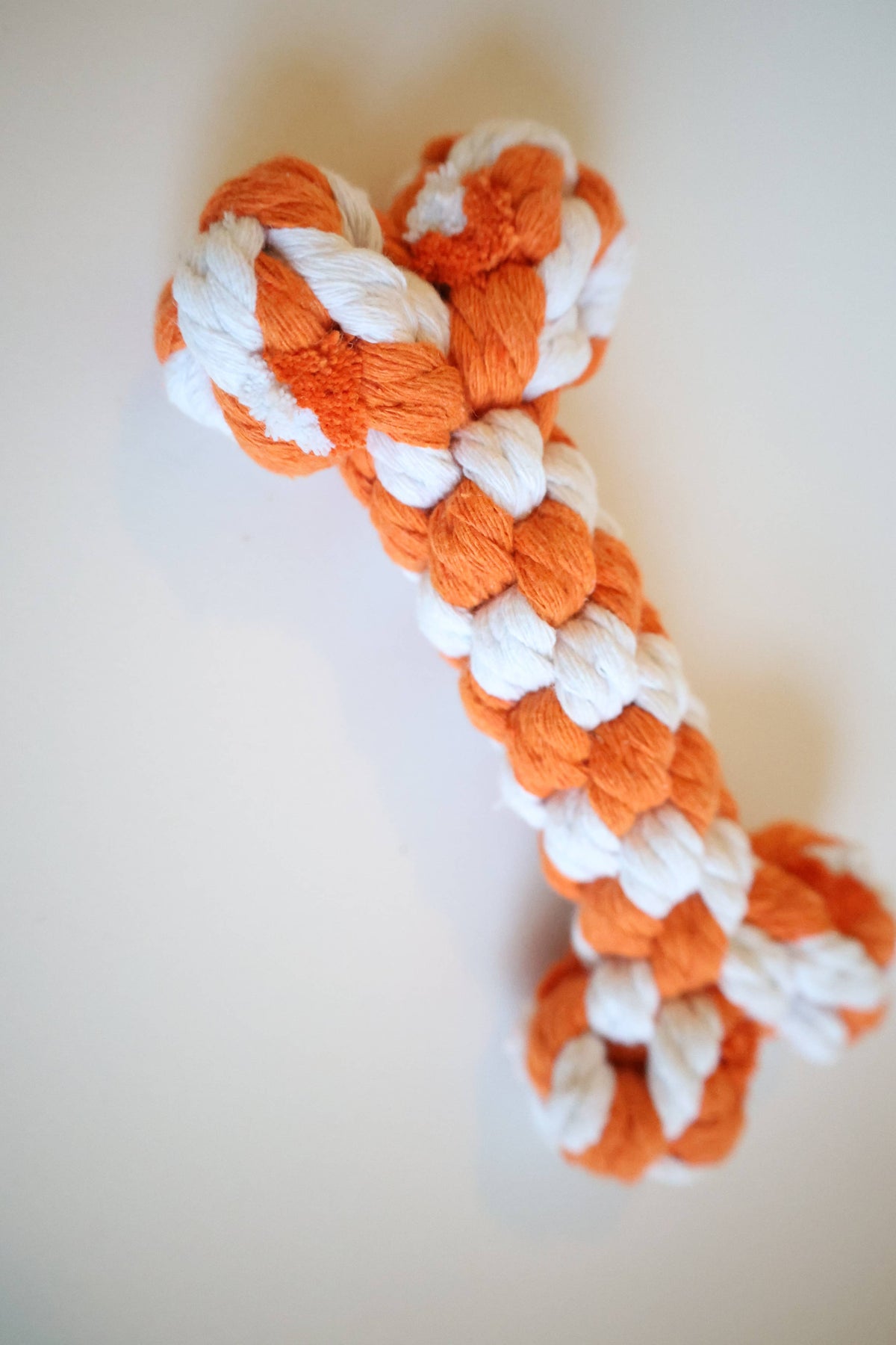 Close-up of the braided cotton weave on a handmade rope bone dog toy