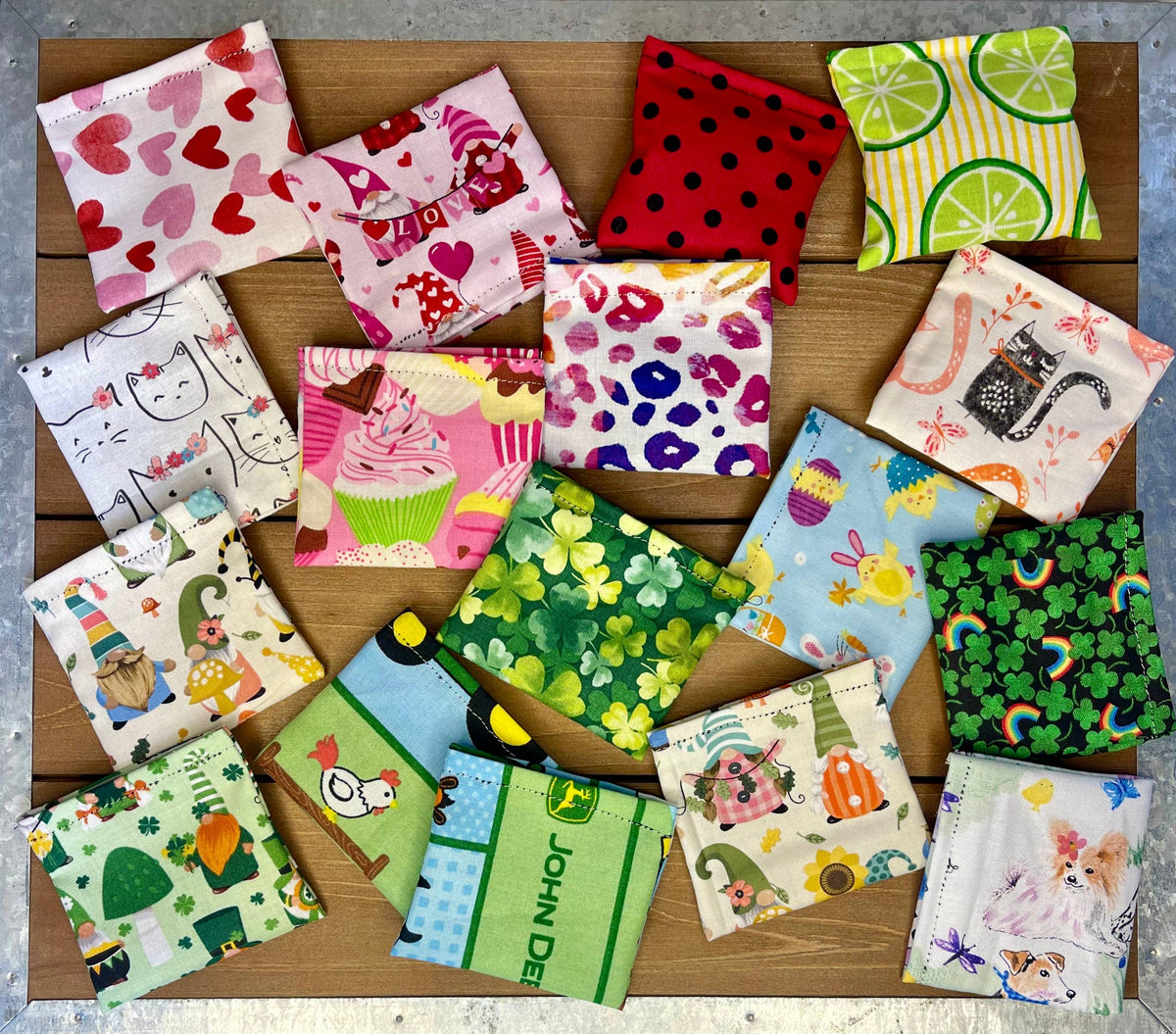 Colorful handmade catnip and silver vine bean bag cat toys in assorted fabric patterns