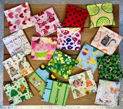 Colorful handmade catnip and silver vine bean bag cat toys in assorted fabric patterns