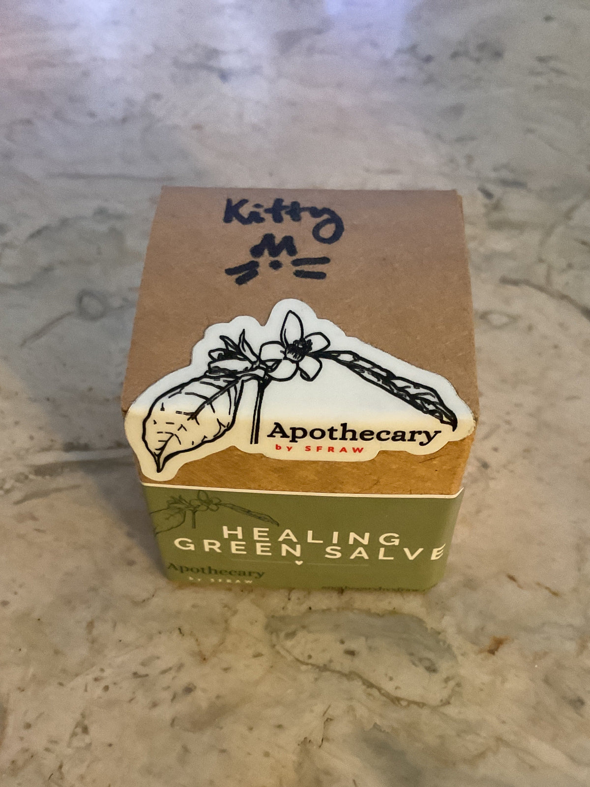 Healing Green Salve for Kitties retail packaging showing the product box and glass jar.