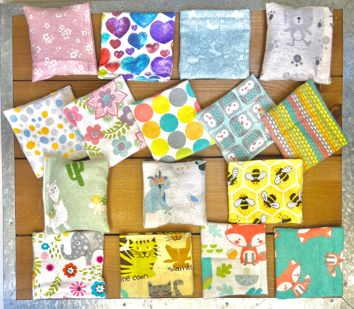 Assorted handmade valerian bean bag cat toys available in colorful fabric designs