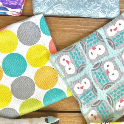 Close-up of handmade fabric valerian bean bag cat toys with assorted designer patterns