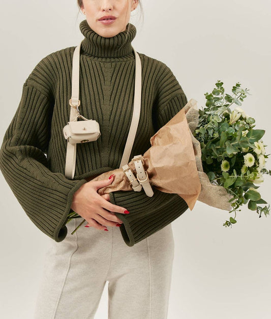 Person wearing the Beige Jala vegan leather leash crossbody during a walk