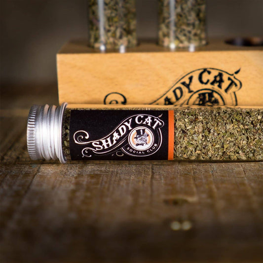 Shady Cat organic catnip and silver vine blend tube displayed beside a branded wooden gift box