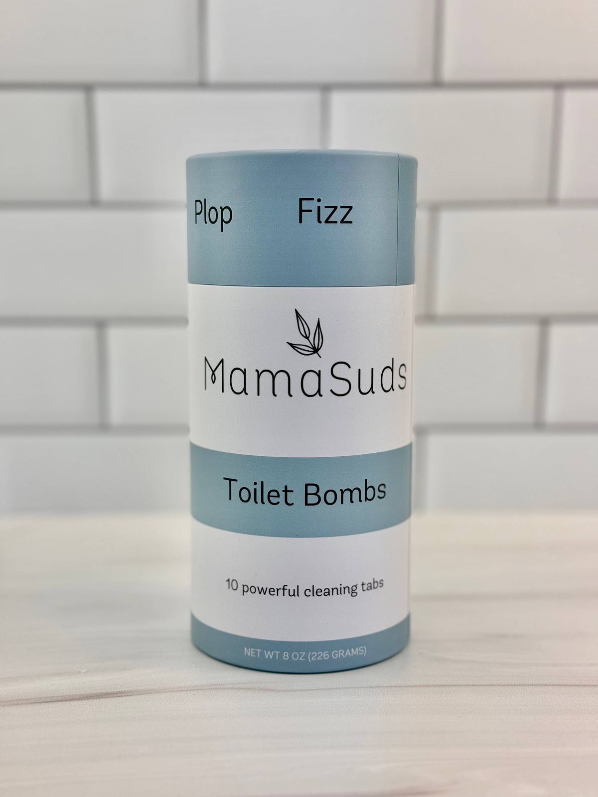 Front view of MamaSuds Toilet Bombs natural toilet cleaning tablets canister.