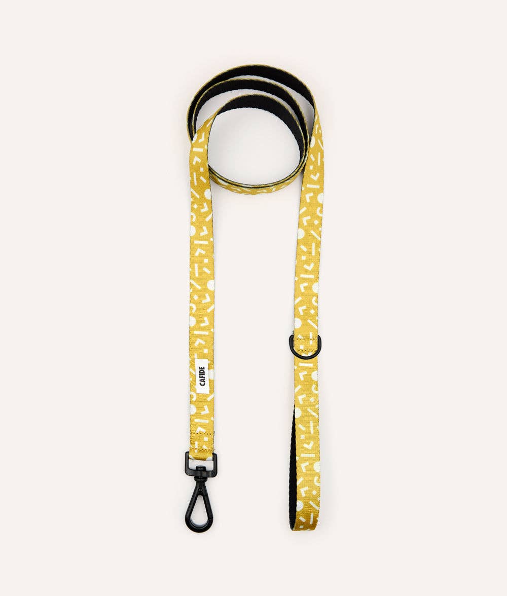 Rolled Memphis Mustard recycled PET dog leash showing integrated accessory loop and premium hardware