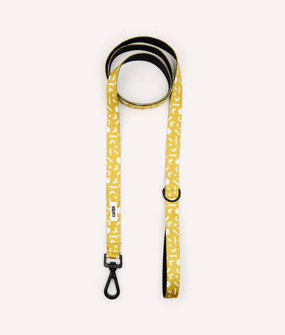 Rolled Memphis Mustard recycled PET dog leash showing integrated accessory loop and premium hardware