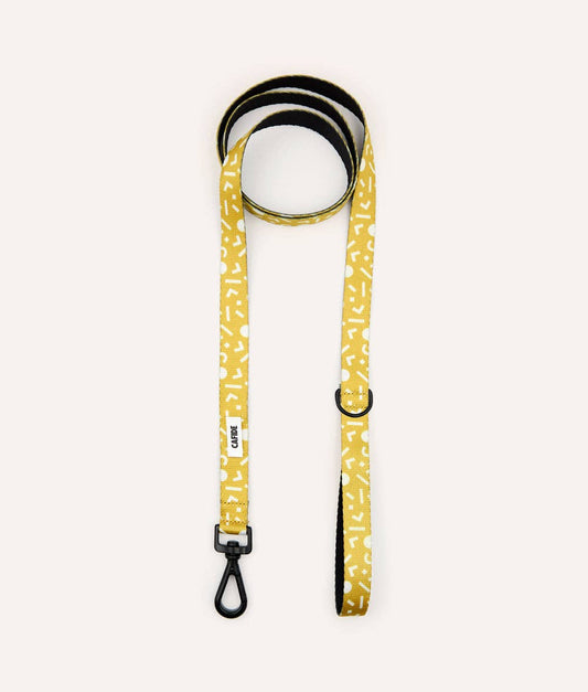 Rolled Memphis Mustard recycled PET dog leash showing integrated accessory loop and premium hardware