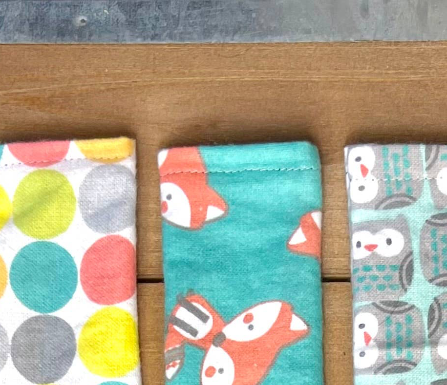 Close-up of handcrafted valerian cat cuddler fabrics and stitching details