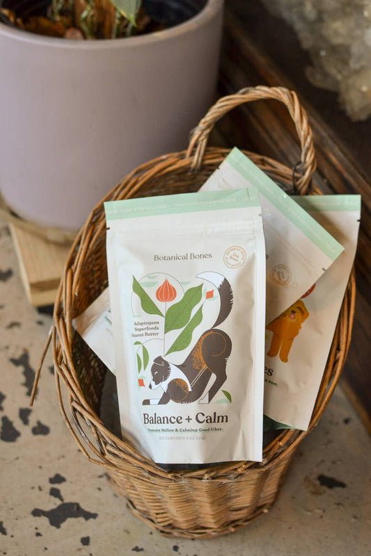 Botanical Bones functional dog treat bundle displayed in a woven basket