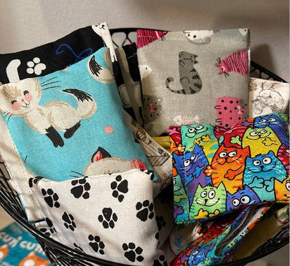 Close-up of handmade catnip and silver vine bean bag cat toys with assorted designer fabrics