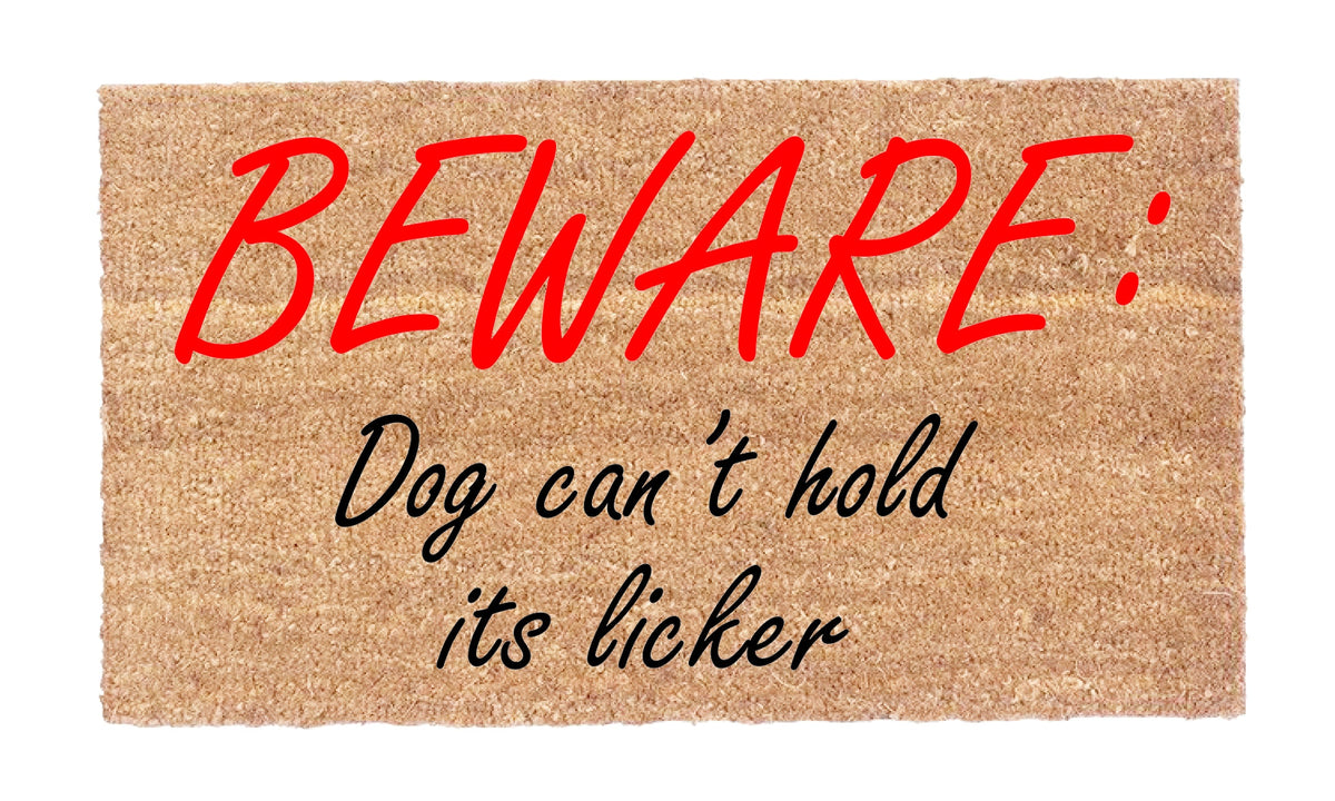 Close-up of Beware Dog Can’t Hold Its Licker coir doormat showing natural coir texture and red and black lettering