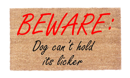 Close-up of Beware Dog Can’t Hold Its Licker coir doormat showing natural coir texture and red and black lettering