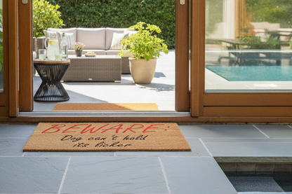 Beware Dog Can’t Hold Its Licker coir doormat positioned at an indoor doorway