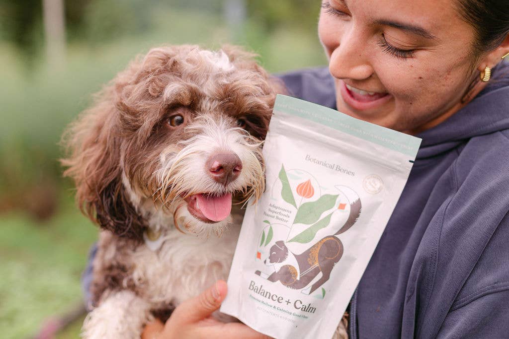 Dog and owner with Botanical Bones Balance + Calm Cookies organic dog treats
