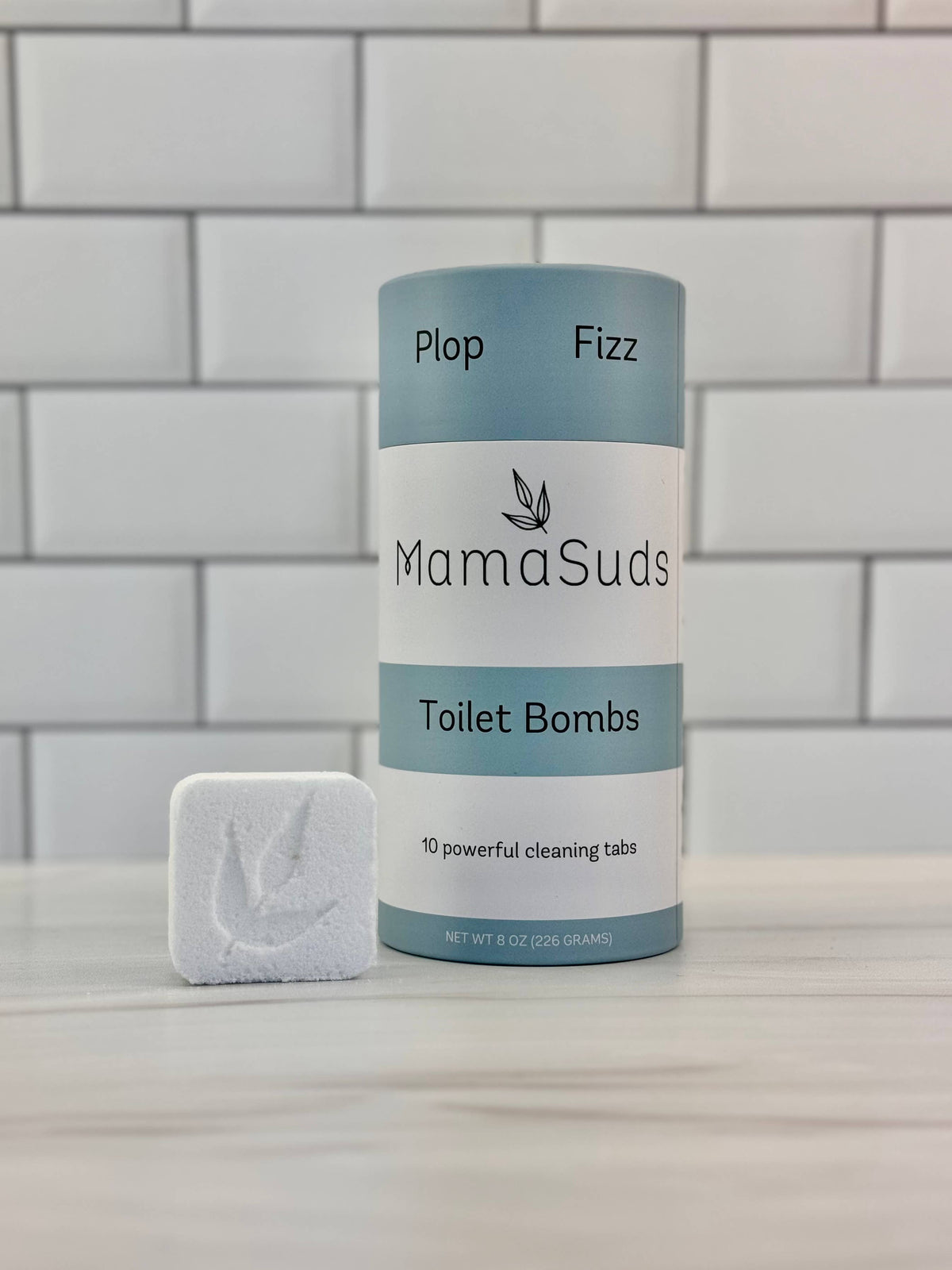 MamaSuds Toilet Bombs canister with a single natural toilet cleaning tablet.