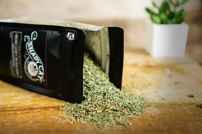 Organic Catnip & Valerian Blend spilling from resealable pouch showing premium herbal texture