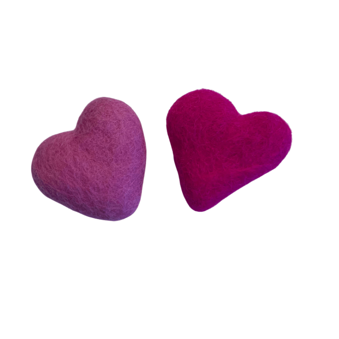 Two assorted-color wool felt heart cat toys showing the heart shape and soft felt texture